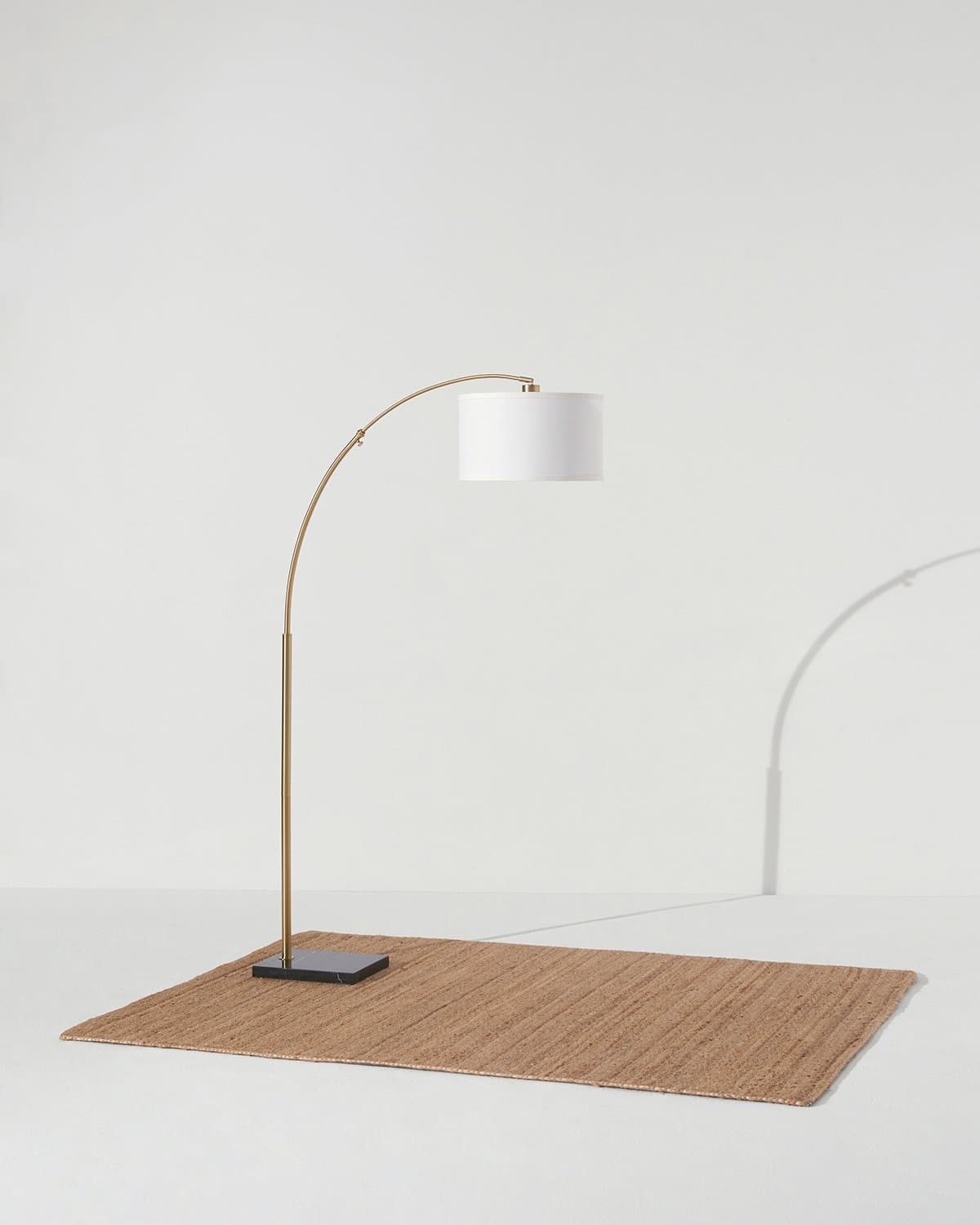 Glowmere Logan Marble Base Arc Floor Lamp with Footswitch in brass