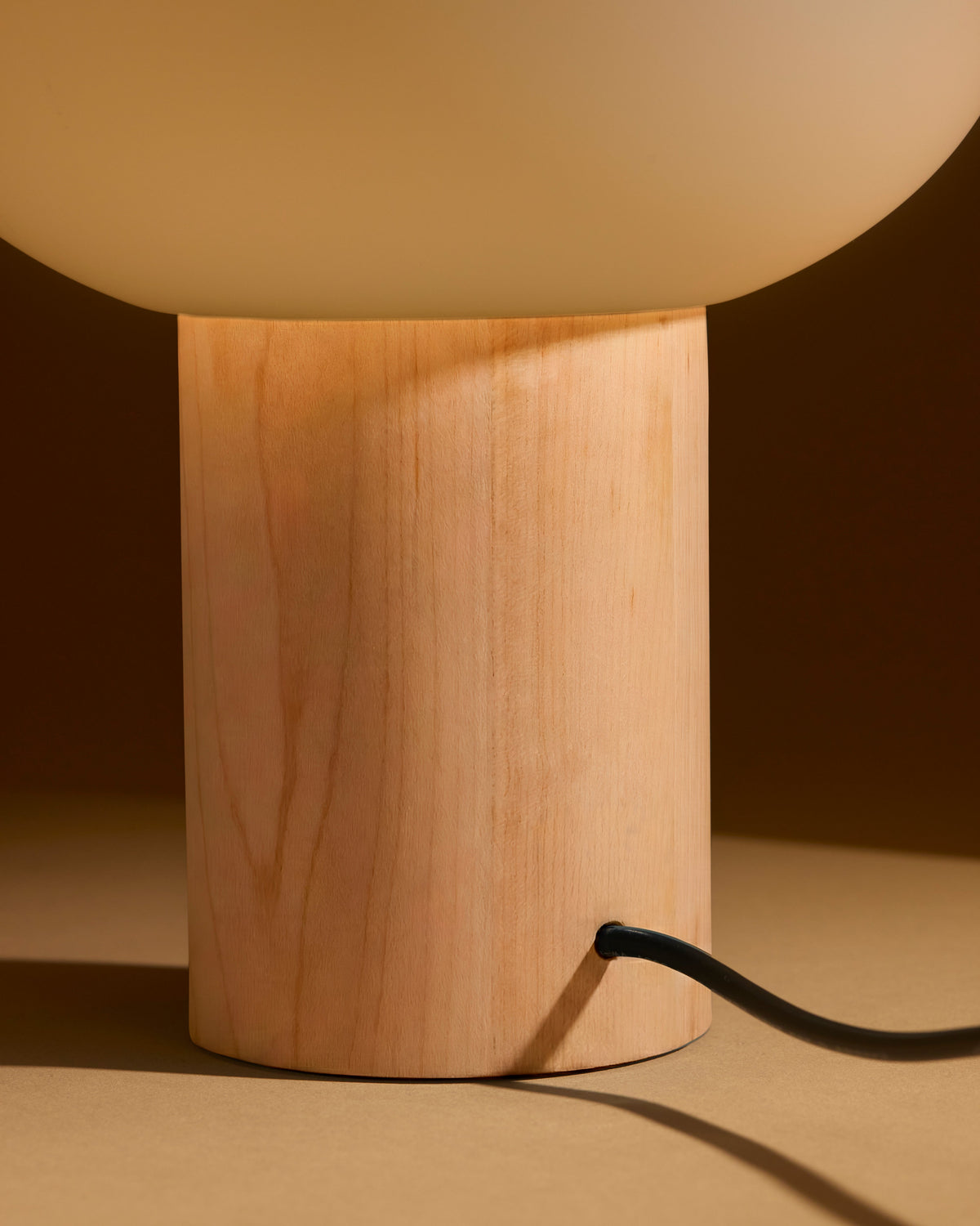 Glowmere Ivy Frosted Oval Globe Minimalist Table Lamp in wood